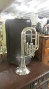 A cased Besson tenor horn,