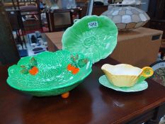 A Carlton ware leaf dish and sauce jug on a plate and an unmatched plate.