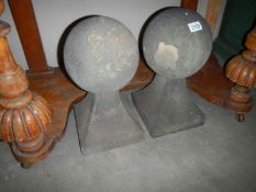 A pair of stone spherical gate post finials, 23 x 23 x 43 cm. COLLECT ONLY.