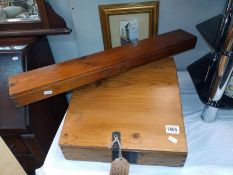 A vintage pine writing desk top. 38.5cm x 38cm.5cm x 19 cm and a longbow arrow box 74cm x 11cm x