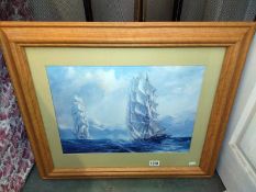 A framed and glazed print of two ships at sea. 70.5cm x 60.5cm