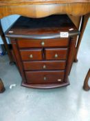 A dark wood stained lounge chest of drawers, magazine rack, side table and pot stand 36.5 x 42.5 x