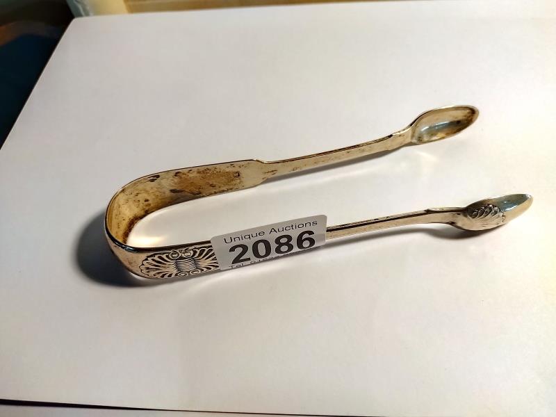 A Newcastle 1827 Silver sugar tongs. Weight 57 grams.