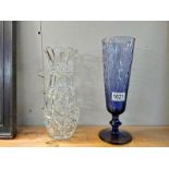 A heavy cut glass vase, 26 cm and a blue glass vase, 30 cm. COLLECT ONLY.