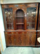 A Georgian style mahogany display cabinet with astragal glazed doors and dental cornice (146cm x