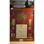 A framed and glazed WW1 death plaque, medal set, letter and photograph, George Henry Langard.