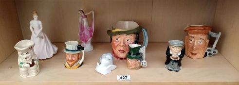 A quantity of Toby jugs and figures.
