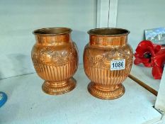 A pair of Copper vases. Height 18cm.