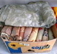 A box of fabric samples, woven textiles designs and a sage green large bedspread
