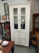 A painted pine cupboard with glazed doors. Height 203cm, 96cm front cabinet 74cm x 41cm. COLLECT