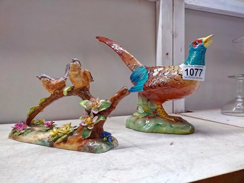A Staffordshire fine bone China birds on a branch by J.T Jones and an Italian pottery pheasant