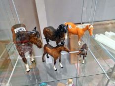 A quantity of Beswick horse figures. Four have minor chips to ears and the larger one has a mark