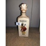 A novelty vintage pottery musical Scots man whiskey decanter