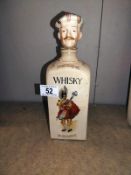 A novelty vintage pottery musical Scots man whiskey decanter