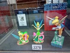 Two Disney Showcase and a Jim Shore Disney Traditions Tinkerbell figures. All boxed