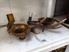 A pair of early 20th Century brass mounted taxidermy and coconut shell smokers stands