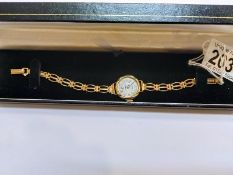 A vintage gold watch in working order with gold strap, 14.5gms