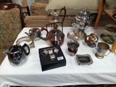 A selection of silver plated ware including teapots, bowls and napkin rings etc.