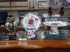 A Linchmere Chinese pottery plate cake stand, lidded jar and ginger jar.