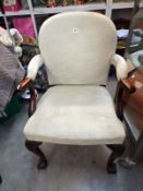 A cream fabric covered chair on ball and claw feet. COLLECT ONLY.