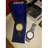 A Seiko automatic calendar watch and a boxed Sekonda watch.