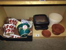 A shelf of plant pots including terracotta. COLLECT ONLY.