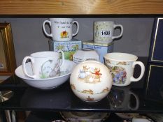 A Royal Doulton Bunnykins and Winnie the Pooh and Wedgewood Peter Rabbit pottery etc