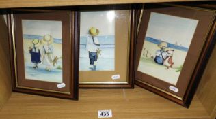 A set of three framed and glazed beach prints.