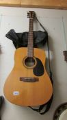 An Encore semi acoustic guitar with canvas carry case, COLLECT ONLY.