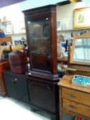 A dark wood stained corner cupboard with cut glass door panel 70 cm x 49cm x height 184 cm.