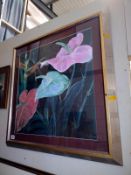 A large silver framed floral print