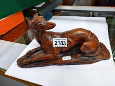 A bronzed resin ornament of a greyhound. Length 30cm.