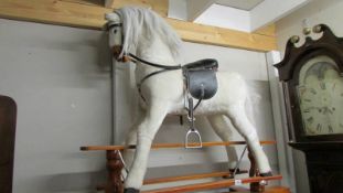 A modern rocking horse, base 36 x 134 x 34 cm high, horse seat 80cm, head 110cm, lenght 90 cm,