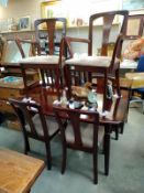 A dark wood stained dining table and six chairs. COLLECT ONLY