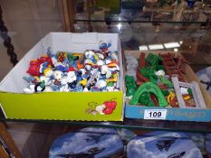 A good selection of vintage Smurfs with extra and catalogue