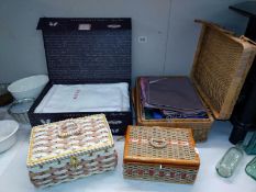 A box & wicker basket of linen & material & 2 sewing baskets & contents