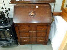 A 1930's oak bureau. 74cm x 41cm x 101cm. COLLECT ONLY.