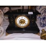 A Victorian black enamel mantel clock. COLLECT ONLY.