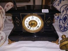 A Victorian black enamel mantel clock. COLLECT ONLY.