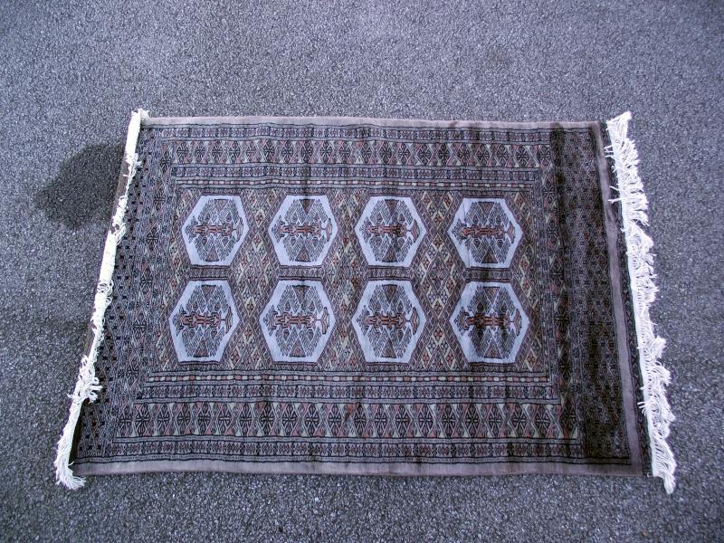 A Turkish style patterned rug. Length 155cm x 98cm. COLLECT ONLY.