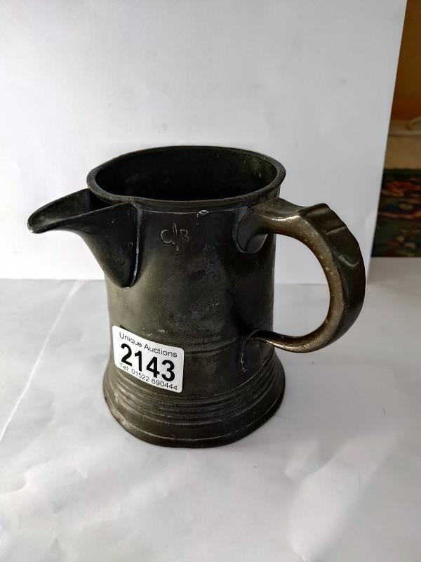 A Victorian pewter tankard with spout faintly engraved Wyndham Arms
