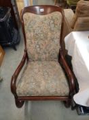 A mahogany framed rocking chair. COLLECT ONLY.