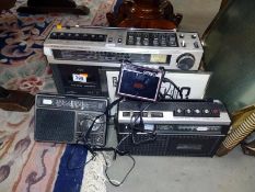 A quantity of radios and a mini cassette player