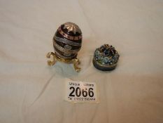 A Faberge' style enamel egg pill box and another enamel pill box.