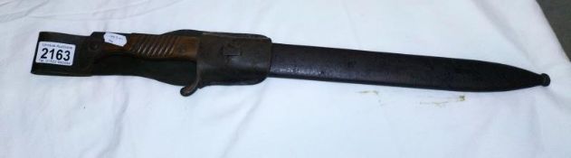 A German sawback butchers bayonet in scabbard COLLECT ONLY