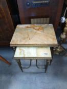 A nest of two gilded white metal tables with green Onyx top. 42cm x 32cm x Height 42cm. 32cm x