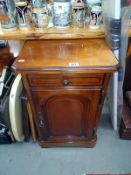 A mahogany effect cupboard with draw. 47cm x 37cm x Height 73cm.