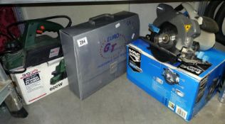 A boxed Mac Allister circular saw, A 600W electric plane and a gas camping stove.