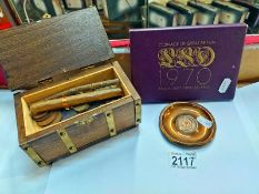 A Swiss music box with contents including George & Victorian coins, cigars 7 1970 coin set