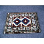 A multi coloured Aztec/Block pattern rug. Length 190cm x 130cm. COLLECT ONLY.